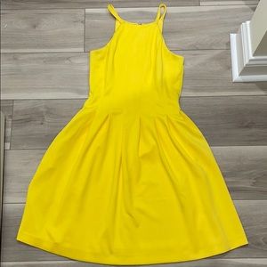Yellow swing dress with exposed gold back zipper